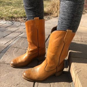 Tan leather cowgirl/cowboy boots.